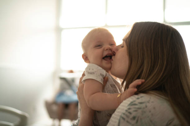 istock Mother kissing her son 1189844212