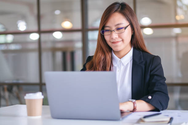 istock businesswoman using and typing on laptop while working in office 1189844286
