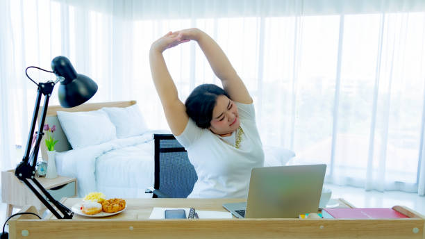 istock Fat women unwell from office syndrome 1189844304