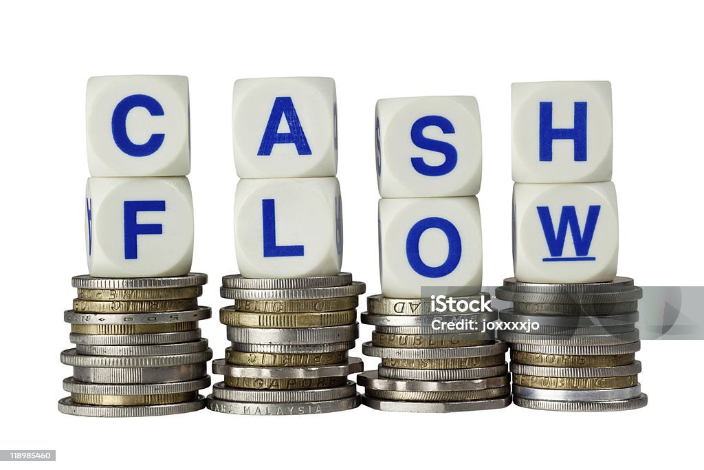 Stacks of coins with the words CASH FLOW on top  Business Stock Photo