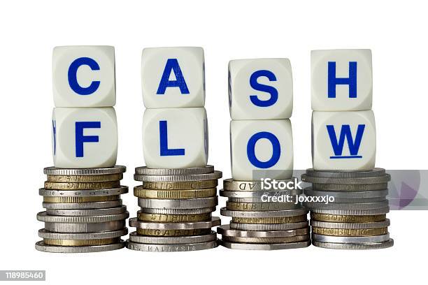 Stacks Of Coins With The Words Cash Flow On Top Stock Photo - Download Image Now - Business, Cash Flow, Coin