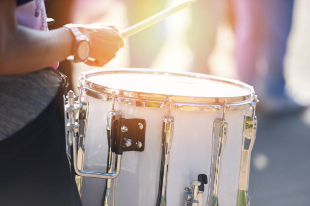 istock Drummers at a parade with white drumming - playing drums during a parade for the celebrations 1189859392