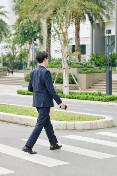 istock Businessman crossing road 1189861972