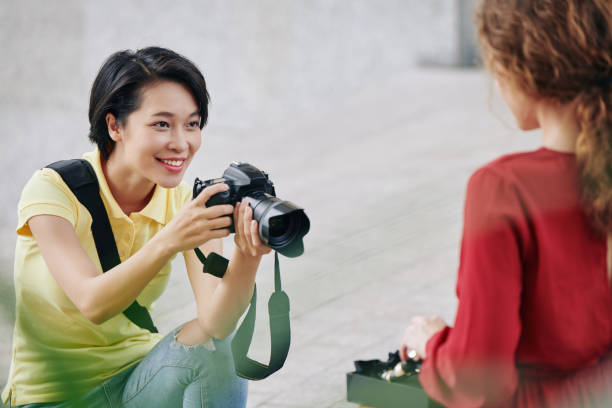 istock Woman photographing model 1189869171