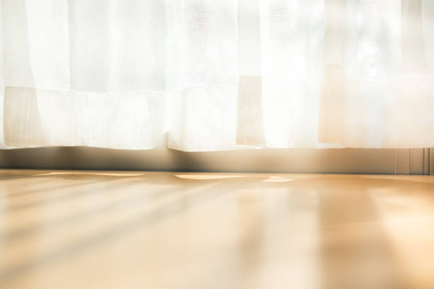 istock morning sunlight through curtain in room 1189869185