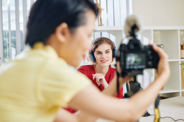 istock Beautiful woman recording video 1189869237