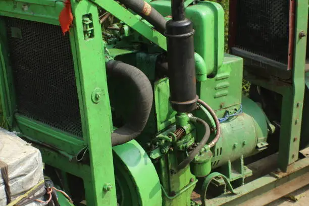 Large green colour electrical power generator. Electrical generator. Diesel generator.
