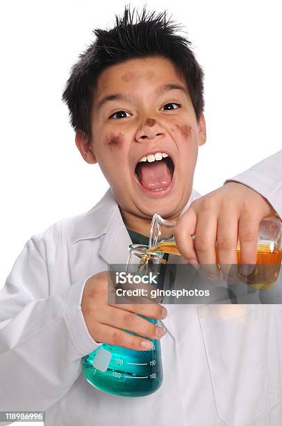 Young Mad Scientist Mixing Chemicals Stock Photo - Download Image Now - Beaker, Bizarre, Boys