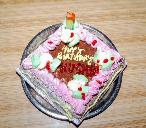 istock Birthday cake with colorful candles 1189873697