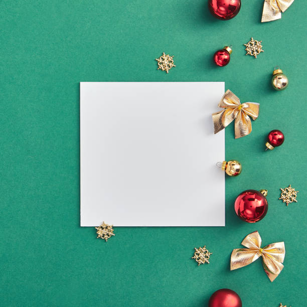 istock Christmas frame on green background with white blank 1189874392