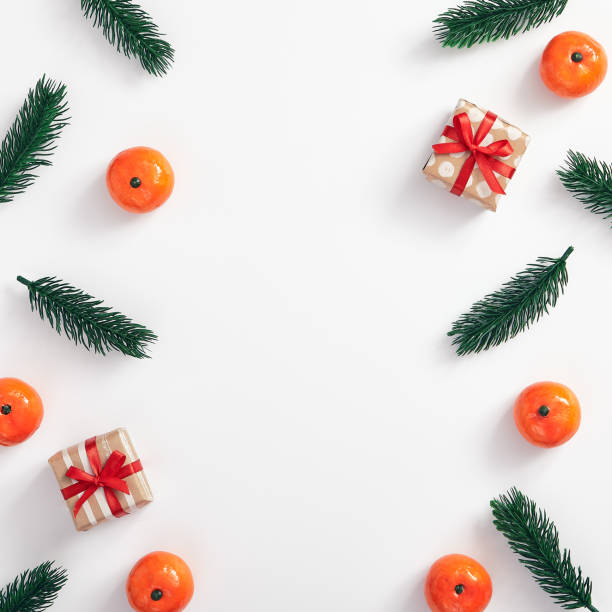 istock Christmas tree branch and tangerine 1189874408
