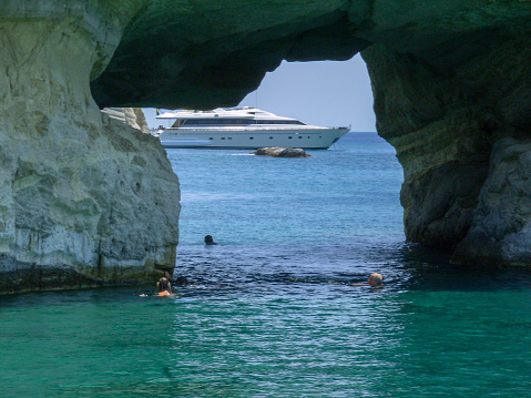 sea in milos island in greece, kleftiko bay rock caves, sea swimming sailing in summer holidays season