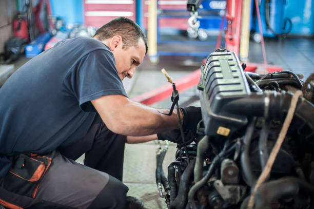 istock Removed engine from car. Auto mechanic repairs car engine 1189876649