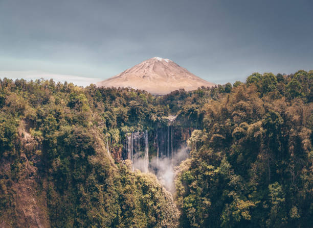 istock Waterfall, volcano and tropical rainforest in Indonesia 1189878369