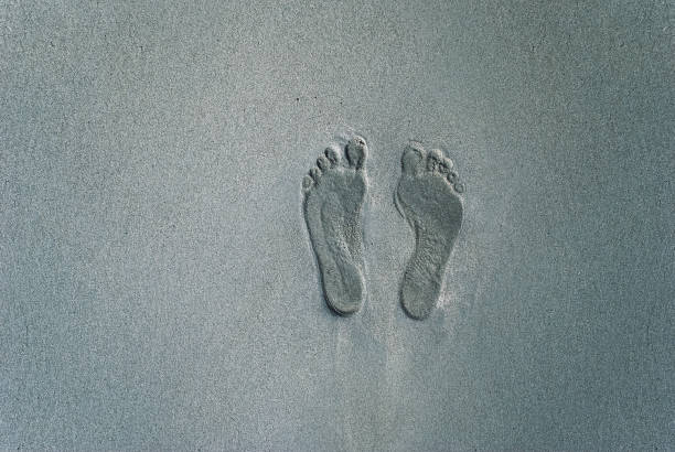Footprint from a human seen in the sand.