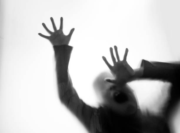 istock A boy trapping behind frosted glass 1189882546