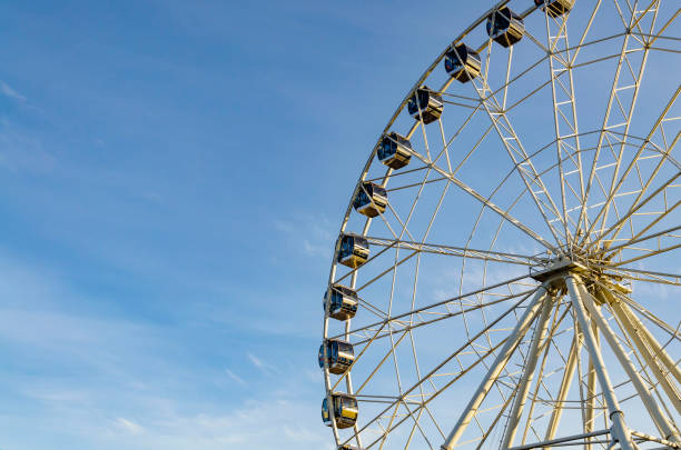 istock part of white ferris wheel against blue sky background 1189883467