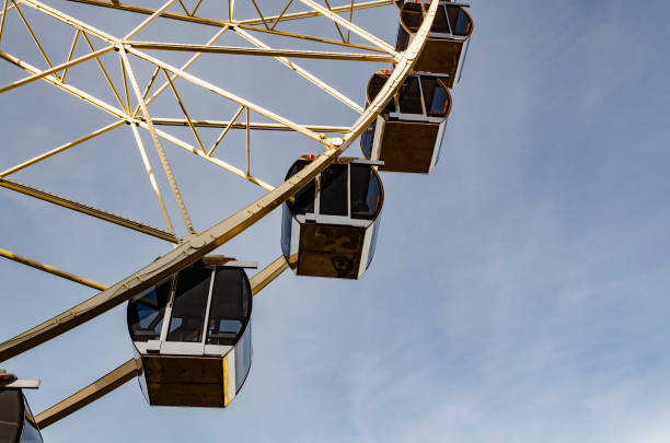 istock Cabins the ferris wheel against the blue sky 1189883468