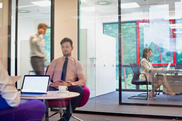 istock Busy business people working in office 1189883478