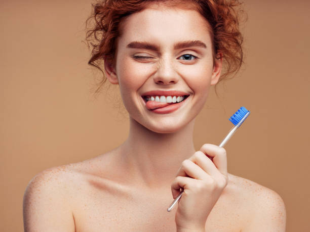 Brushing teeth can be fun Brushing teeth can be fun dyed red hair photos stock pictures, royalty-free photos & images