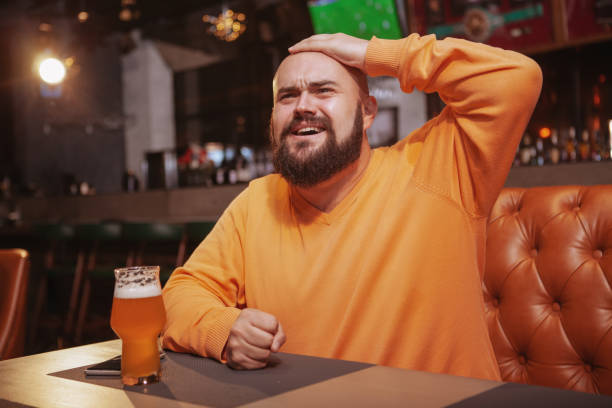 istock Bearded man drinking beer at the pub 1189884759