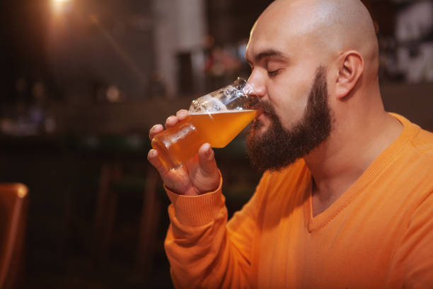 istock Bearded man drinking beer at the pub 1189884794