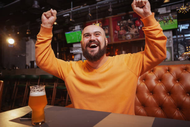 istock Bearded man drinking beer at the pub 1189884831