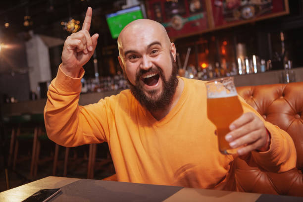 istock Bearded man drinking beer at the pub 1189884860