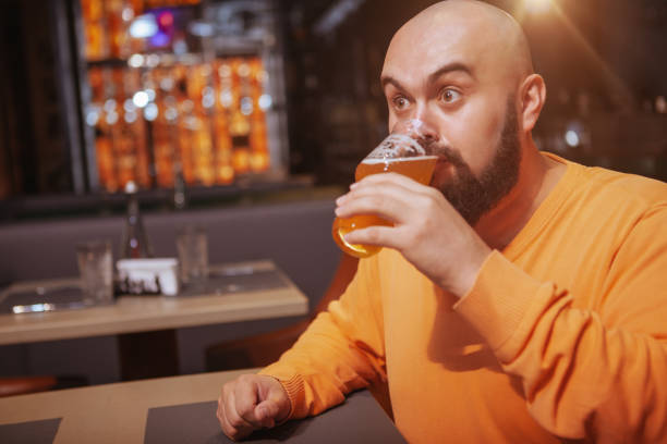 istock Bearded man drinking beer at the pub 1189885047