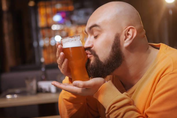 istock Bearded man drinking beer at the pub 1189885048