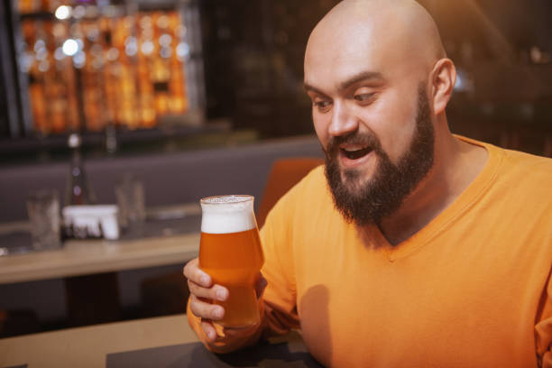 istock Bearded man drinking beer at the pub 1189885057