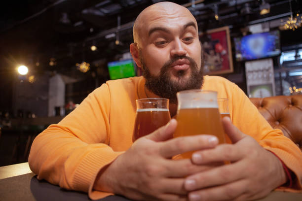 istock Bearded man drinking beer at the pub 1189885133