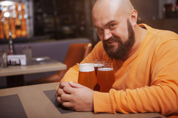 istock Bearded man drinking beer at the pub 1189885167