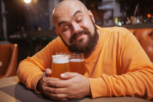 istock Bearded man drinking beer at the pub 1189885212