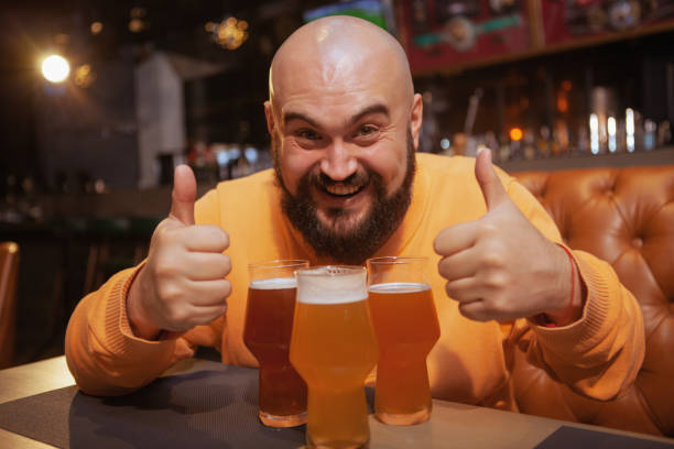 istock Bearded man drinking beer at the pub 1189886314