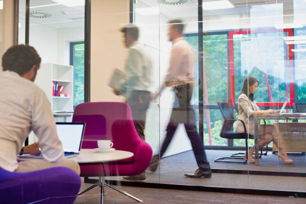 istock Busy business people working in office 1189886761