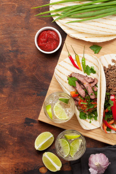 istock Mexican tacos and caipirinha cocktail 1189886765