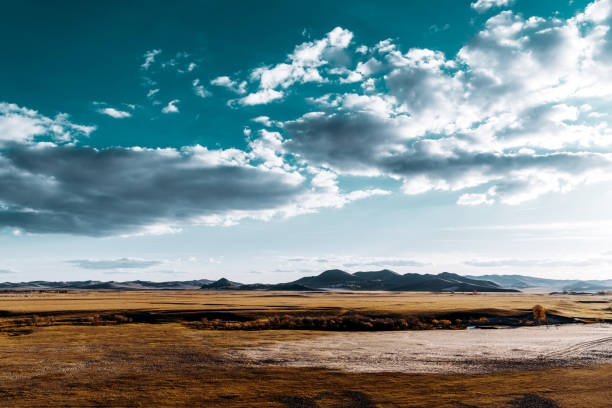 Autumn grasslands and mountains, Inner Mongolia, China.