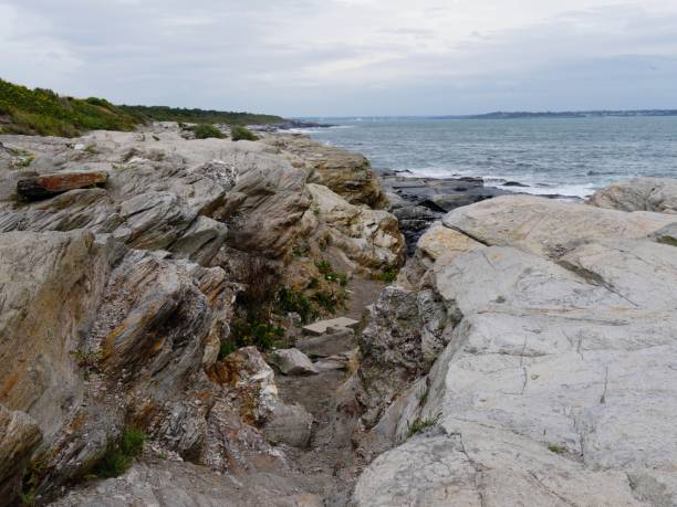 istock Rock formations along the coastline in Jamestown, Rhode Island. 1189888260