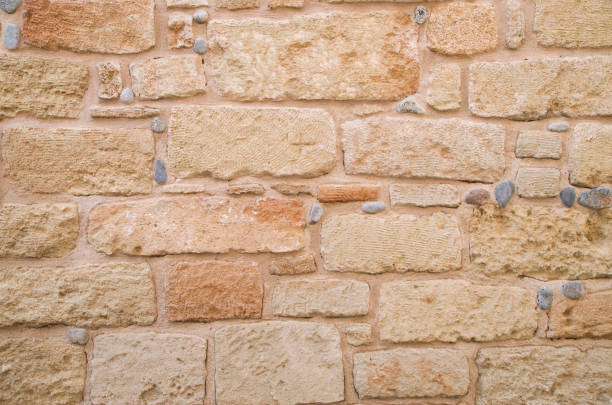 istock Colorful ancient stone wall closeup 1189888303