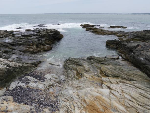 istock Small limestone cove with water flowing into the rocks 1189888477