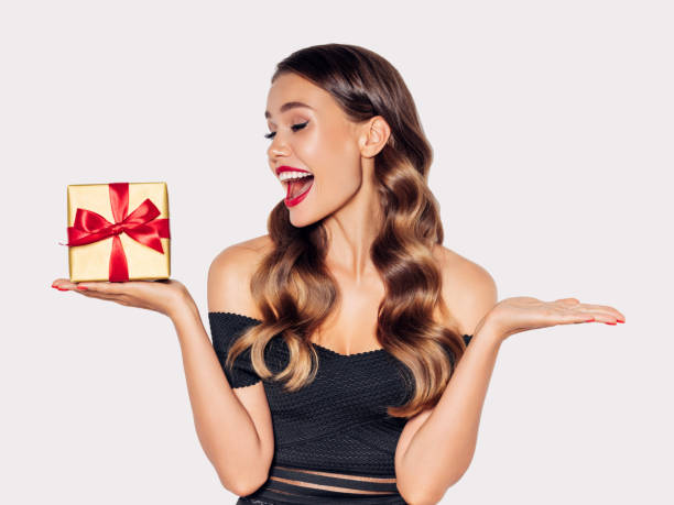 istock Beautiful woman with present 1189890685