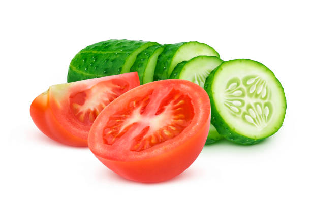 istock Fresh tomato and sliced cucumber isolated on white background 1189892368