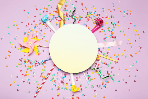 istock Colorful flat lay composition with various party items on purple background 1189892505