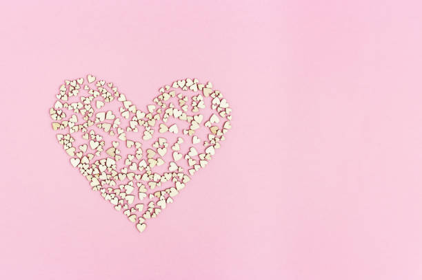 istock Big heart consists from many small hearts on pink background with copy space for text or congratulations. Love or holiday concept . 1189892586