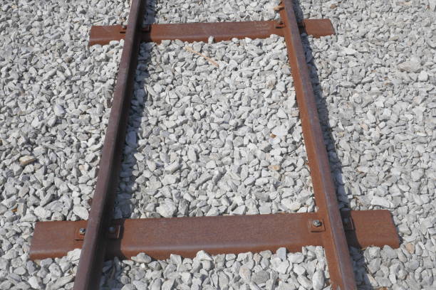 istock Part of a rusty train rail in the grevel. 1189894348