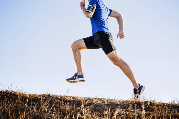 istock male runner running uphill 1189895765