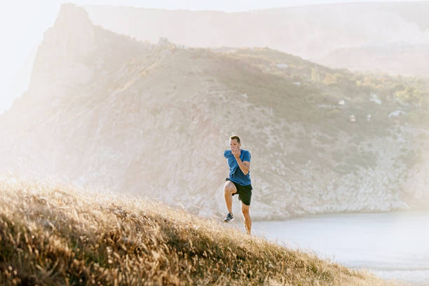 istock male runner running uphill 1189895770