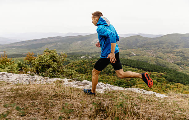 istock mountain trail male runner run 1189895886
