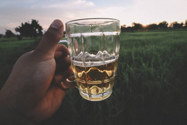 istock southeast asian man happily drinking beer 1189898394